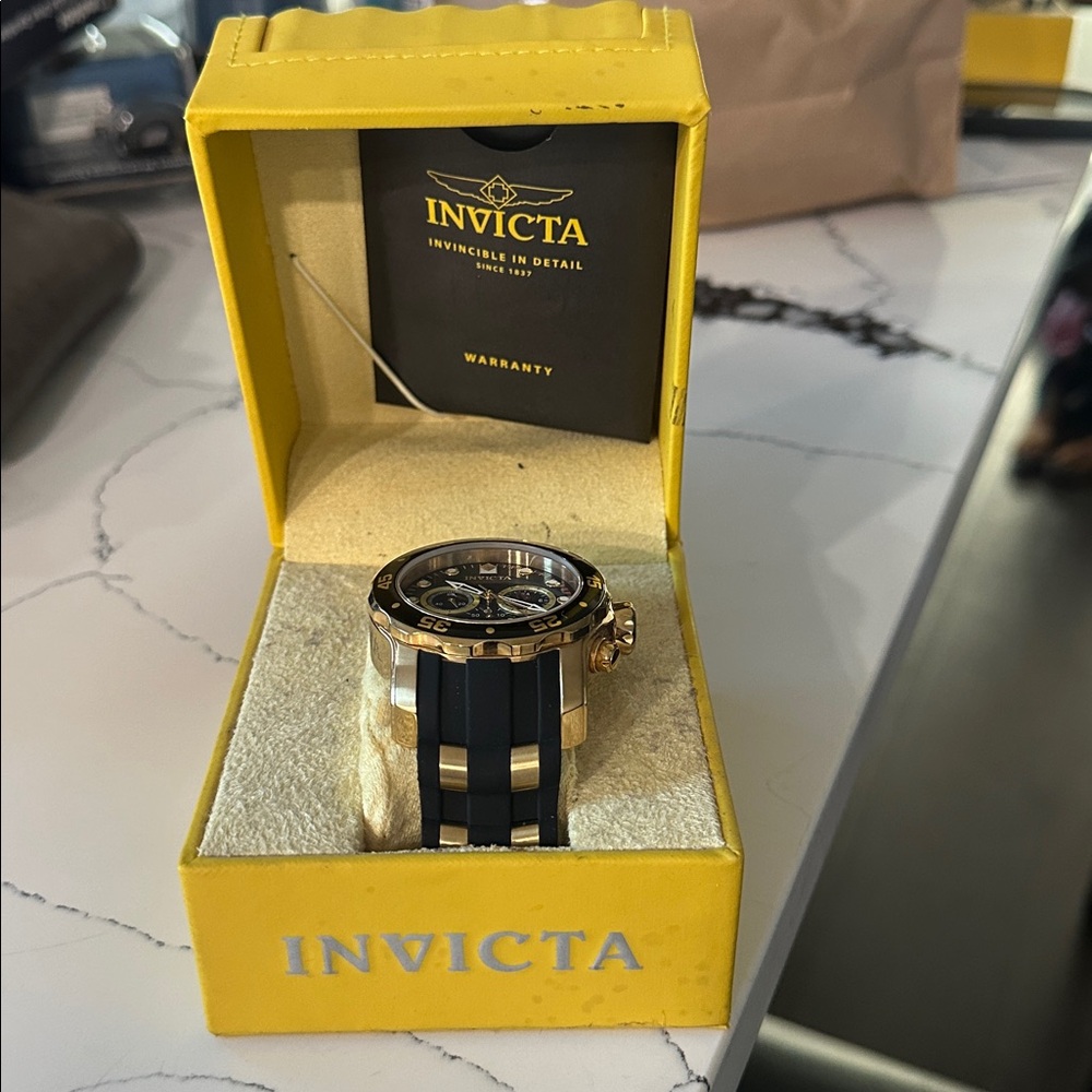 Invicta Gold and Black Chronograph Watch